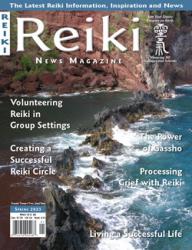 Reiki News Magazine Spring 2023 featuring a scenic view of ocean waves crashing against dark rocks.