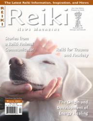 Reiki News Magazine Winter 2023 cover featuring hands cradling the head of a white dog.