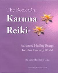 Purple “The Book on Karuna Reiki®” cover with two yellow lotus flowers and text about advanced healing energy by Laurelle Shanti Gaia.